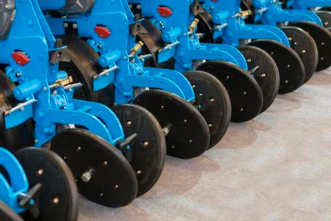 Corn harvester head with several silver blades. Agricultural machinery for so Stock Photos