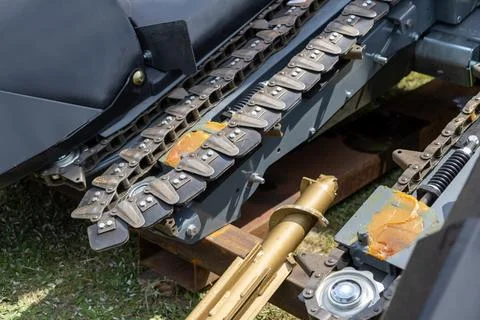 Corn header chain drive with feeding plates hydraulic cylinder Stock Photos