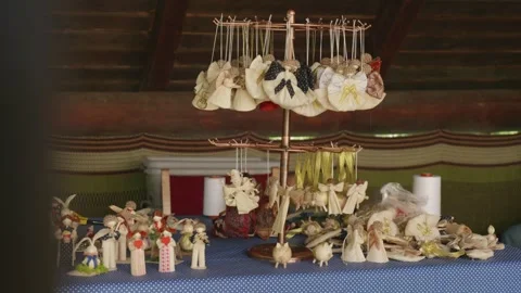 Corn husk figurines hanging on a stand – eco sustainable folk decoration Stock Footage 313792676