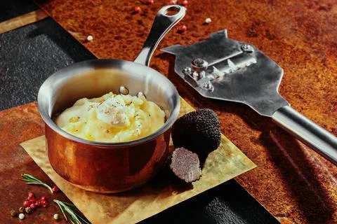 Corn kernels in bechamel sauce with cheddar cheese served in a saucepan on a Stock Photos