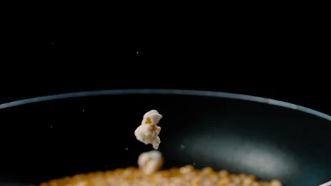 Corn kernels frying and popping into popcorn Stock Footage 274643349