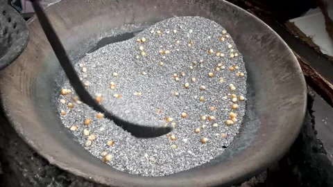 Corn Kernels Roasting in Hot Sand in Iron Wok - Traditional Street Food Method Stock Footage 341432219