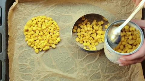 Corn mixture on baking sheet with metal ring Stock Footage 317726381