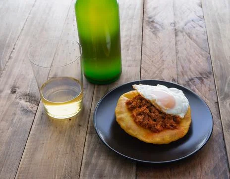 Corn pancakes with picadillo and fried egg. Copy space. Stock Photos