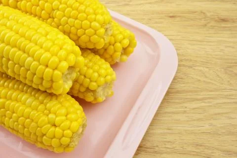 Corn on pink tray Stock Photos