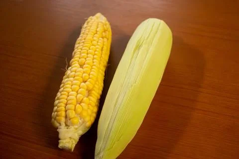 Corn that is placed on the table is brown Stock Photos