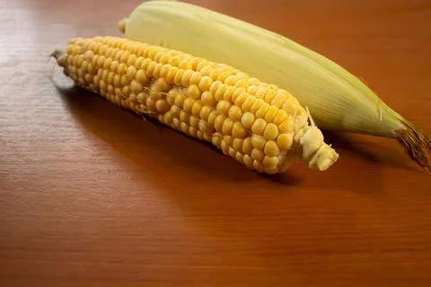 Corn that is placed on the table is brown Stock Photos