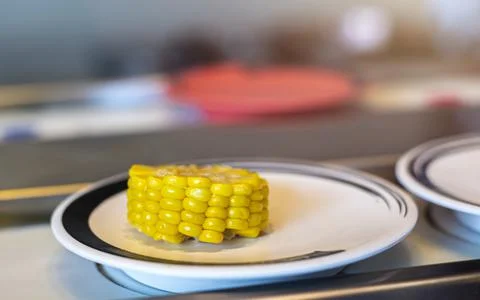 Corn on a plate in a restaurant. Foto stock