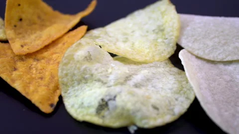 Corn, Potato and Fruit Chips Revealed by Slow Slider Movement Stock Footage 345611156