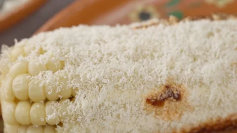 A corn preparation known as elote prepared with mayonnaise Cheese and hot sauce Stock Footage 280316919