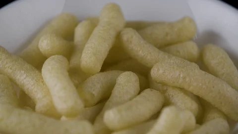 Corn puff snack in a bowl Stock Footage 94326791