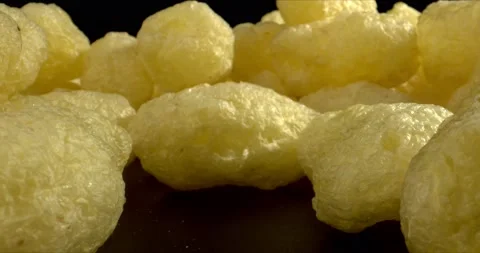 Corn puffs. Close-up of puffcorn snack in the bowl. Puffed corn chips snacks Stock Footage 149689318