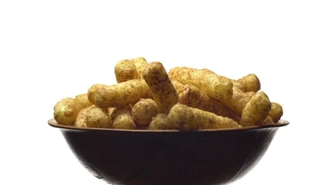 Corn puffs. Rotation. Close up. Puffcorn with peanut flavor.Isolated on white. Stock Footage 101296914