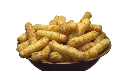 Corn puffs. Rotation. Close up. Puffcorn with peanut flavor.Isolated on white. Stock Footage 101297545