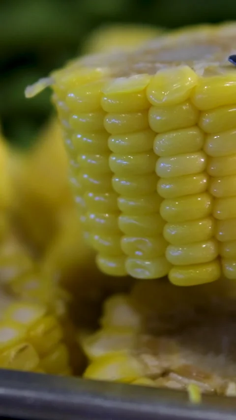 Corn slices tongs Barbeque brazier with a set of two cooked beef steaks and four Stock Footage 313741821