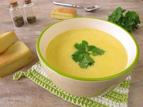 Corn soup and small corn breads Stock Photos