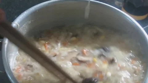 Corn soup with chopsticks on fire Stock Footage 70572358