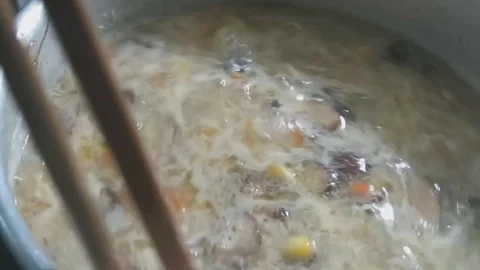 Corn soup on the fire Stock Footage 70572402