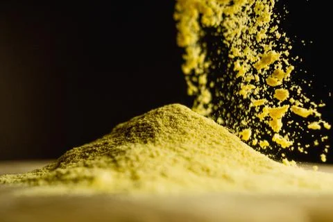 Corn starch, ingredient, movement, black background Stock Photos