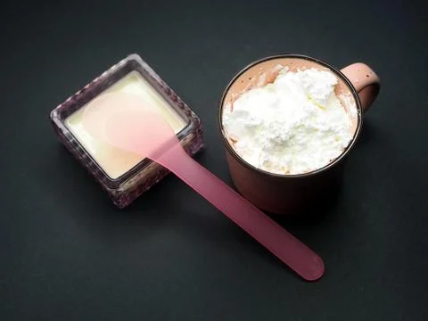 Corn starch in a mug and a face mask 写真素材