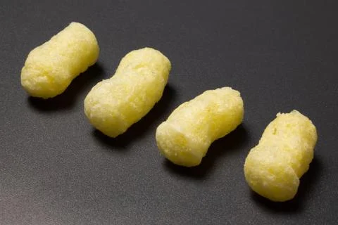 Corn sticks close-up on a dark background Stock Photos