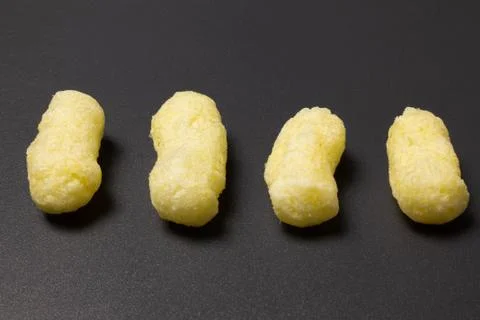 Corn sticks close-up on a dark background Stock Photos