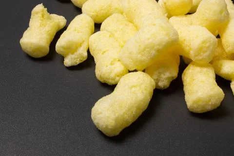 Corn sticks close-up on a dark background Stock Photos