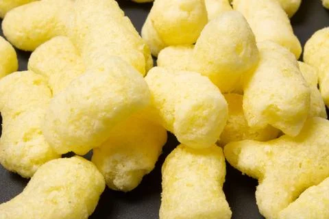 Corn sticks close-up on a dark background Stock Photos