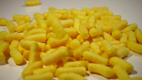 Corn sticks fall on the table, spill out of the pack Stock Footage 131468303