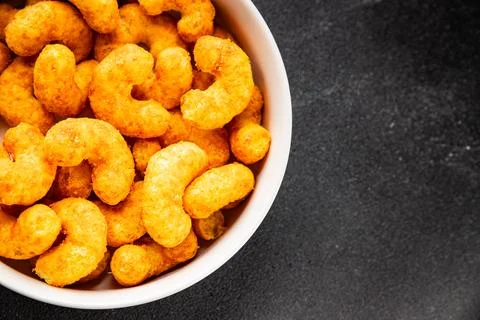 Corn sticks or chips, salty appetizer bacon flavor food dish tasty snack fr.. Stock-Fotos
