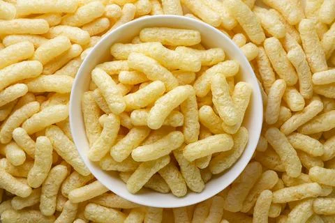 Corn sticks in a plate background. Top view Stock Photos