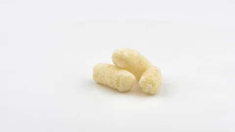 Corn sticks on a white background closeup. Видео 129851194