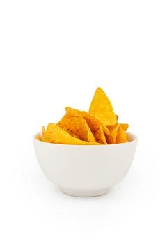 Corn triangles nachos chips in white ceramic bowl isolation on white Stock Photos