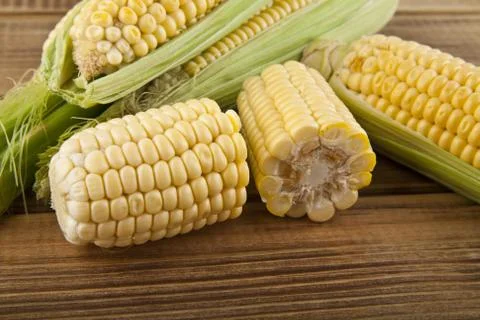 Corn on a wooden table close-up Stock Photos