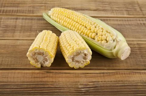 Corn on a wooden table close-up Stock Photos
