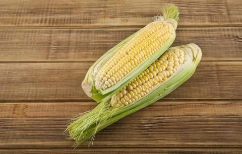 Corn on a wooden table Stock Photos