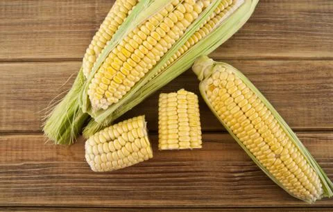 Corn on a wooden table Stock Photos