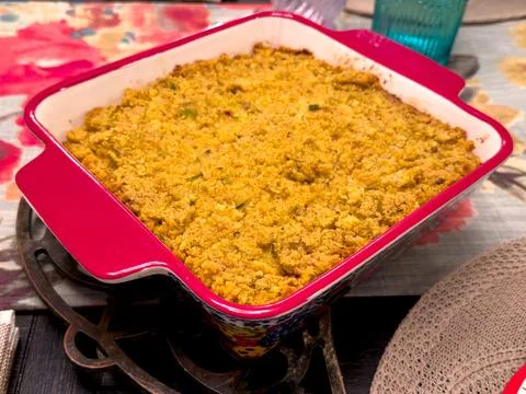 Cornbread Casserole in Red Baking Dish on Festive Table Stock Photos