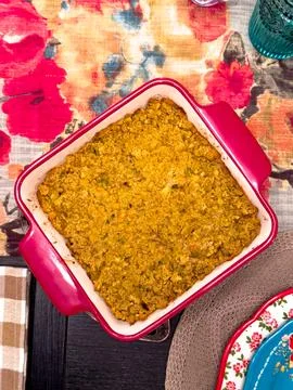 Cornbread Casserole in Red Baking Dish on Holiday Table Stock Photos