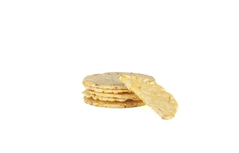 Cornbread, half a breadcrumbs on a stack of whole cornbreads. Stock Photos