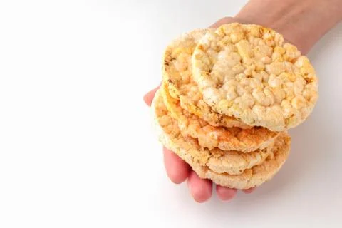 Cornbread in hand on a white background. healthy food. macro. isolate 스톡 사진