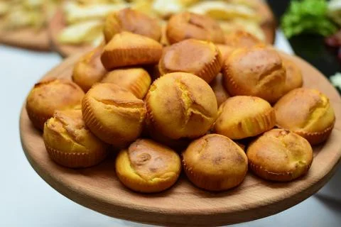 Cornbread muffins on wooden board Stock Photos