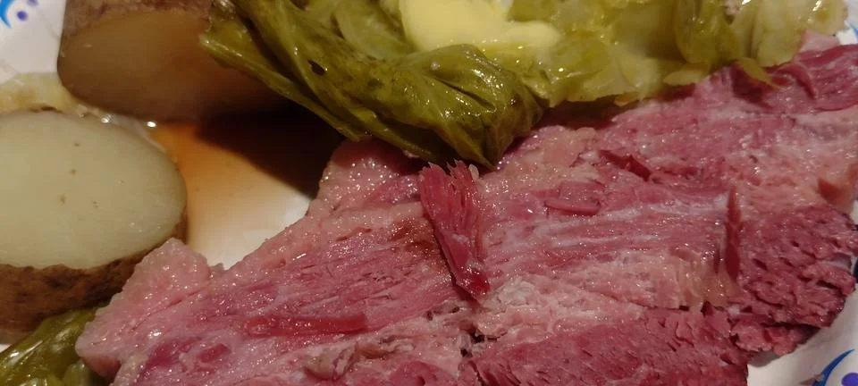 Corned beef and cabbage with potatoes butter and vinegar dinner photo Stock Photos