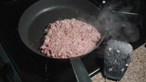 Corned beef hash browning in a hot skillet on a stovetop Video stock 314291802