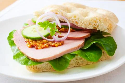Corned beef or ham sandwich on focaccia bread Stock Photos