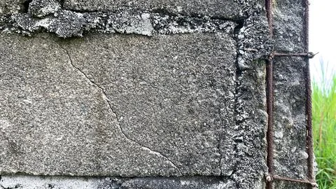 Corner adobe wall with corroded structural steel framing Stock Photos