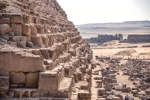 Corner of the ancient pyramid of Cheops with huge blocks of stone of which it Stock Photos
