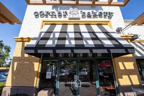 Corner Bakery Cafe store front entrance, marquee, logo, sign, stripped canopies Stock Photos
