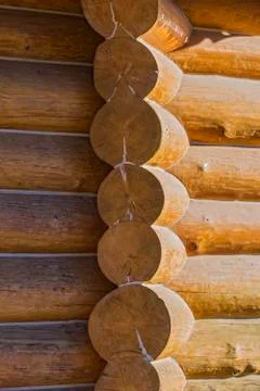 Corner of blockhouse from logs. Texture of logs from the wooden house. Stock Photos