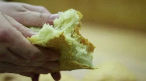 Corner Bread CU open up small piece Stock Footage 9484624